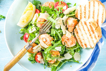 Healthy food concept, Diet salad plate. Fresh seafood salad recipe. Grilled shrimp prawns, fresh vegetable salad and egg.
