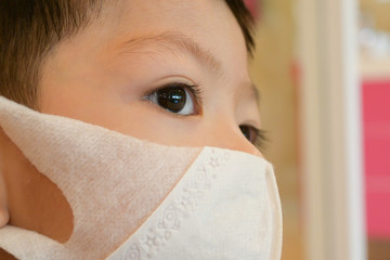 cute kid wear hygienic face mask protection care your self from disease spread infection and air pollution