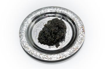 black caviar on a beautiful silver plate