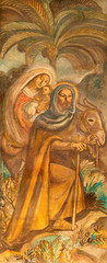 Fototapeta na wymiar BARCELONA, SPAIN - MARCH 3, 2020: The fresco of Flight to Egypt in the church Parroquia Santa Teresa de l'Infant Jesus by Francisco Labarta (20. cent.).