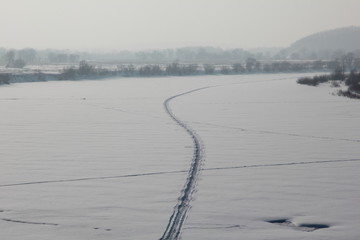Winter road along the Ussuri riverbed