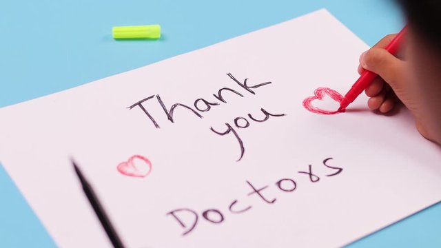 Kid preparing thankful greetings to the doctors and medical frontliners, who working during coronavirus or covid-19 pandemic
