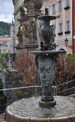 Historical architectural bas-relief fountain in the historical part of Karlovy Vary