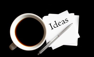 Office table with supply and coffe cup. View from above for text Ideas