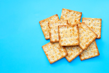 Crackers with sugar on blue background.