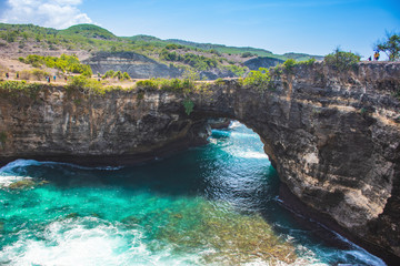 A seascape of Broken beach shore green-aqua water wave from the top during the summer day touristic visit in Nusa penida