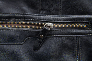 The zipper on the black bag is half buttoned. Concept background with copy space