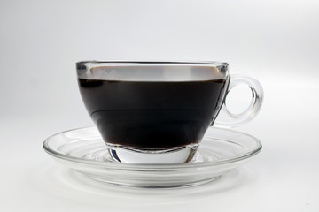 dark Coffee poring white milk dripping splash shadow liquid swirl in glass cup saucer on white background