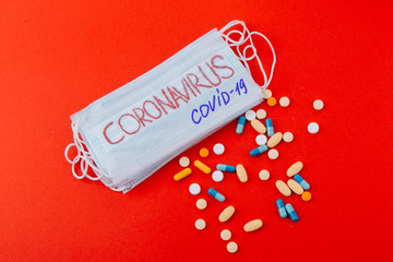 Protective medical mask with the inscription Coronavirus and medicines.