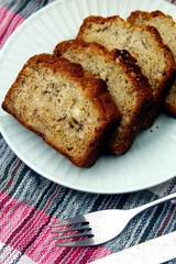 Sliced banana bread loaf and orange juice drink