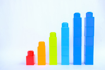 Business graph and chart content.
colorful plastic building blocks arrangement in a graph-like layout isolated on white background