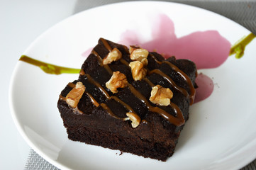 chocolate cake with walnuts. brownie cake. sweet dessert.