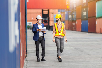 Engineer and worker team checking containers box from cargo, Logistic and teamwork concept