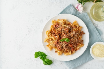 Pasta Bolognese campanelle with mincemeat and tomato sauce