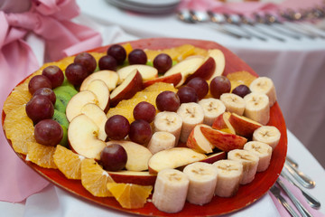 fresh fruits cut and on skewer on event candy table with fondue