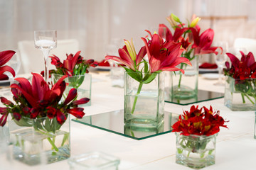 
floral decoration on table in party room for an event, decoration centerpieces with natural flowers
