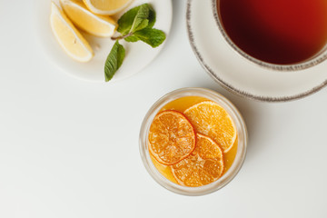 Chia pudding with orange and lemon tea on a white background
