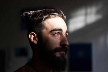 Man portrait, dark background, close up 