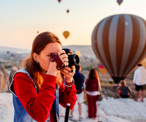Girl taking photo in Cappadocia