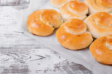 Yeast buns with filling on the parchment paper