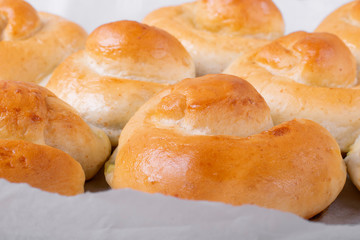 Yeast buns with filling on the parchment paper