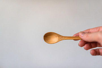 hand holding spoon