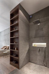 Concrete wall in bathroom and bedroom