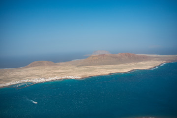 Aerial view on the coastline of Lanzarote island on a sunny day 