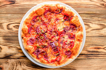 Delicious italian pizza served on wooden table