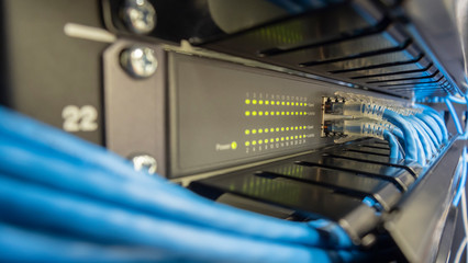 Network switch hub in rack cabinet. Network connection technology.