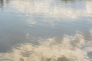 Water in the river. Water with light waves. Beautiful background.