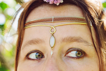 Closeup of young womans head wearing romantic metal tiara on her forehead © marbenzu
