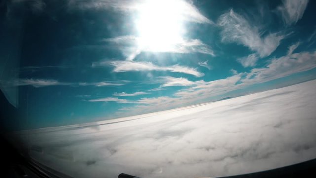 Time lapse from the cockpit of a commercial airplane descending and approaching to an island. Front view
