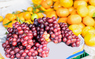Asian fruit assortment such as grapes and orange Hoi An reflex