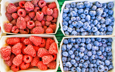 Closeup of fresh raspberry and blueberry reflex