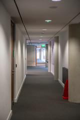 Empty long corridor in a modern office building.