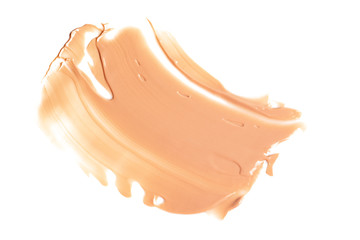 Liquid foundation smears isolated on white background. Cream texture for makeup.