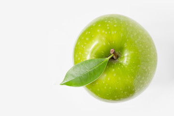 Green apple with leaf on white background top view