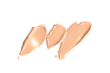 Set of liquid gently beige smears of makeup creamy foundation isolated on white background. Cosmetic concealer. Realistic brown cream texture for makeup.