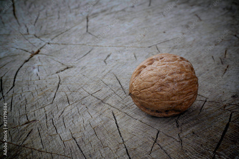 Wall mural almonds on wooden background