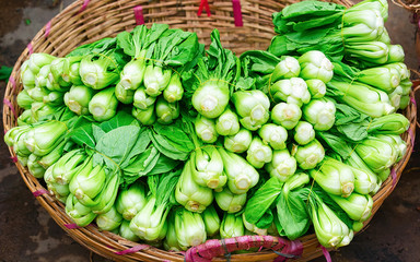 Green chinese cabbage in street market in Can Tho reflex