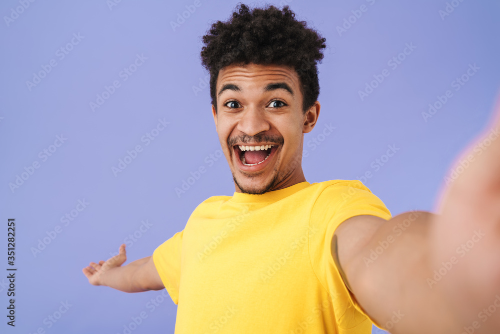 Poster Photo of african american man taking selfie and holding copyspace