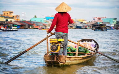 Woman selling watermelon at Floating market at Mekong Can Tho reflex