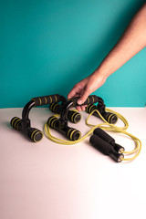 A hand taking sport equipment to do home sport. Planches 
