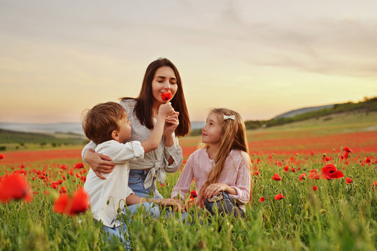 Family In Poppy Field