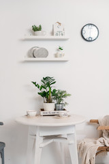 white dining table on a white wall