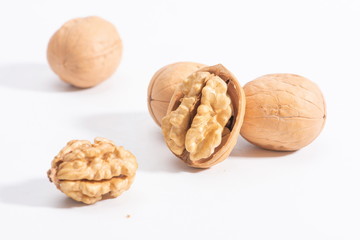 A pile of walnuts isolated in a white background.