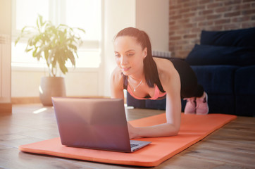 Woman training at home.Sport and recreation concept.