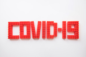 description covid-19 of the constructor blocks on the white background