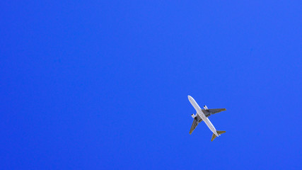 Naklejka na ściany i meble air plane in the background of blue sky